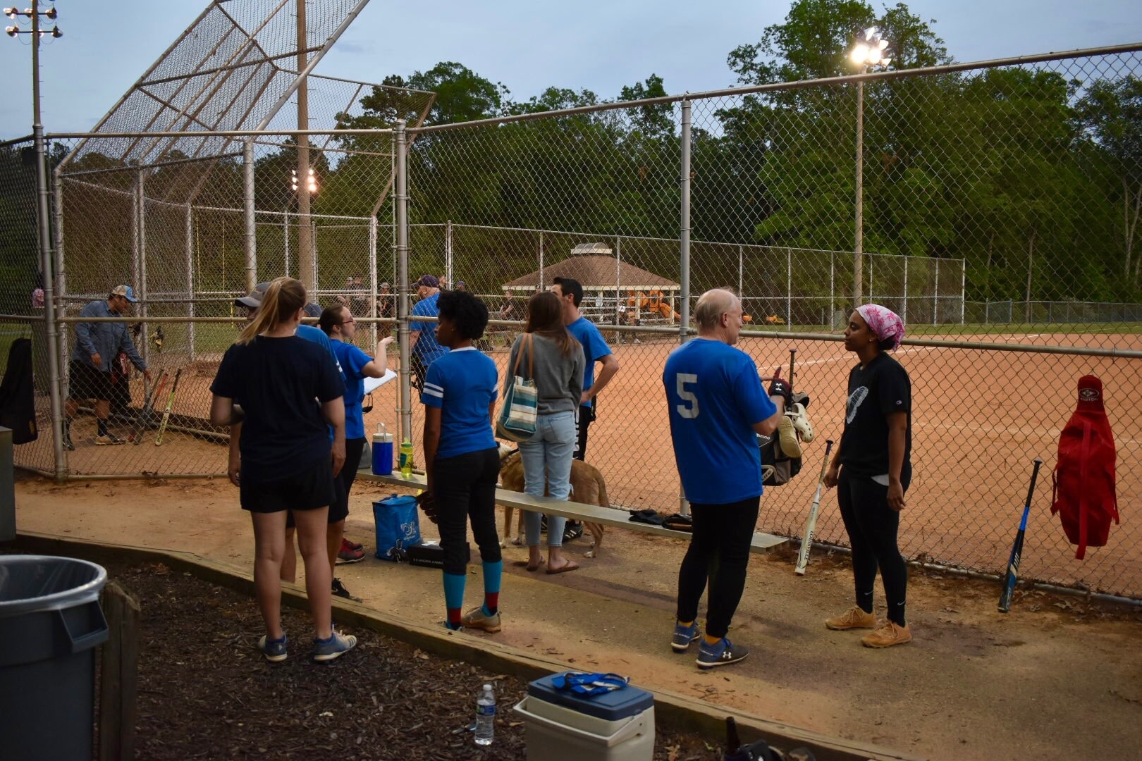 The Hail Mary softball team at bat and waiting for the action to start