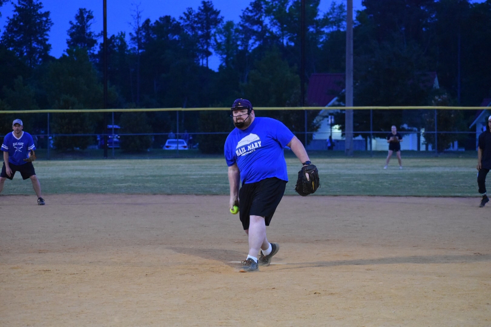 Hail Mary pitcher Brent delivers the ball in a Richmond Virginia coed rec softball game in June 2022