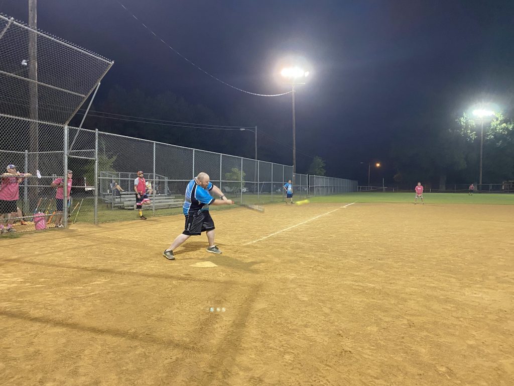 Brent (P) hitting a double.