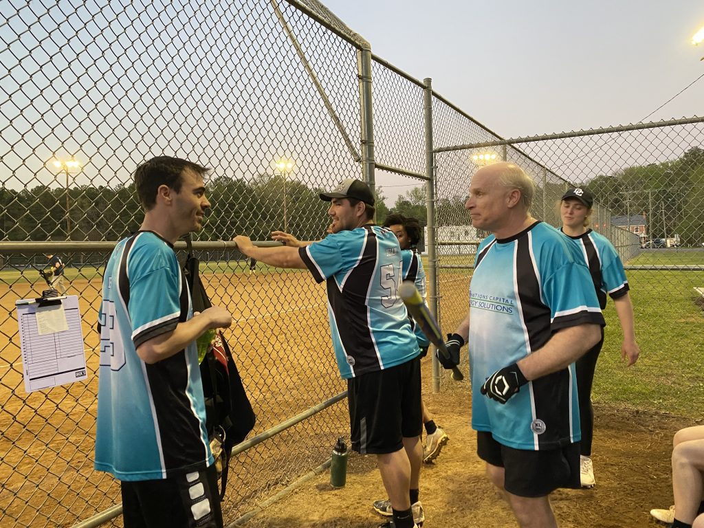 Eric and Brian talk as Juan continues to observe the onfield action