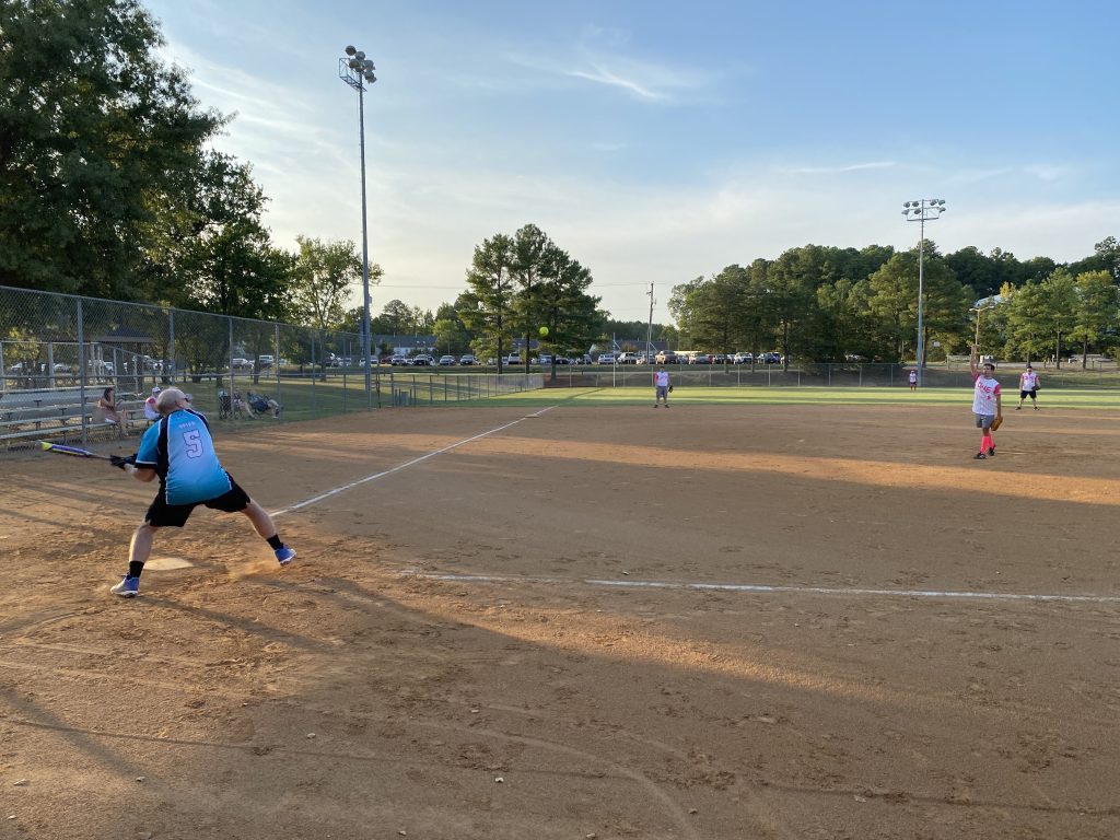 A group of people playing a game of softball for RVA Softball Team Photos.