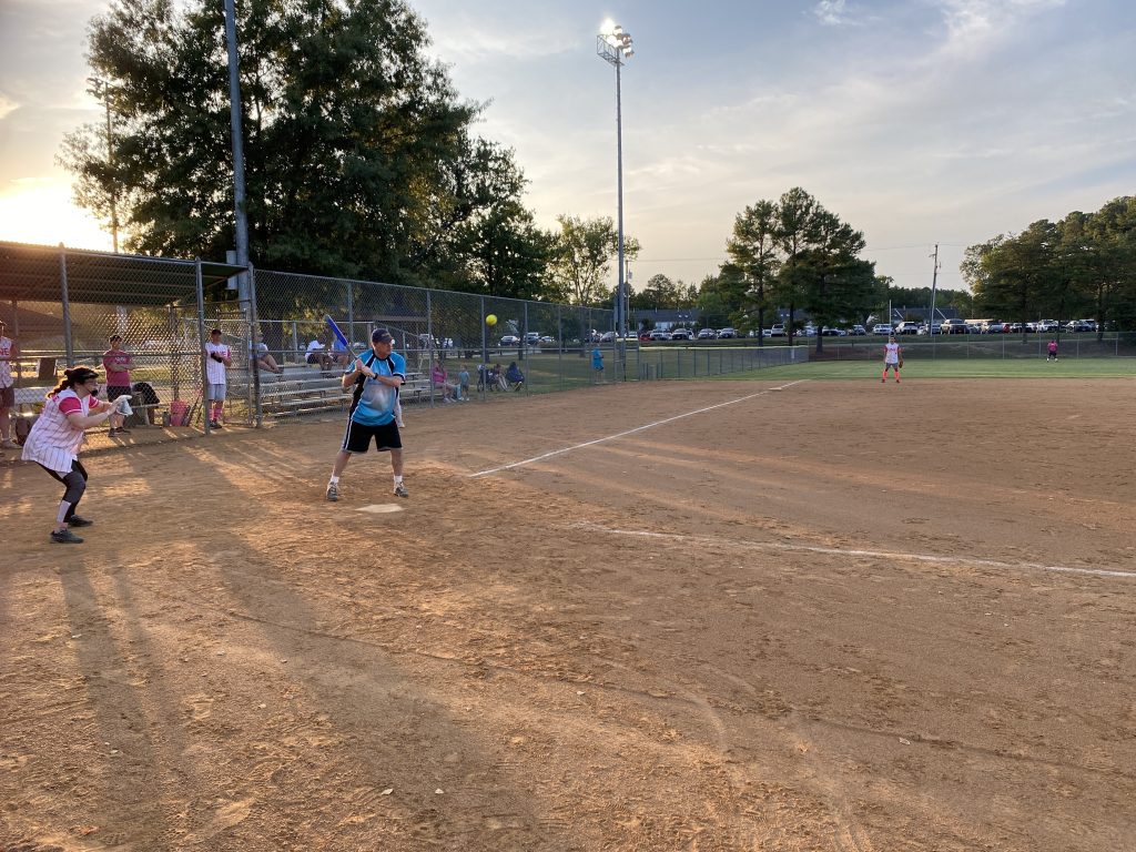 A group of people playing a game of softball for RVA Softball Team Photos.
