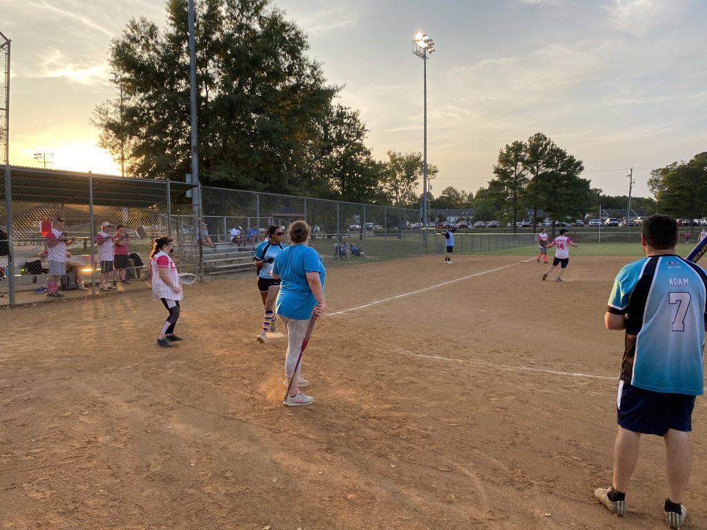 Group of people playing a game of softball for Hail Mary Softball Photos.