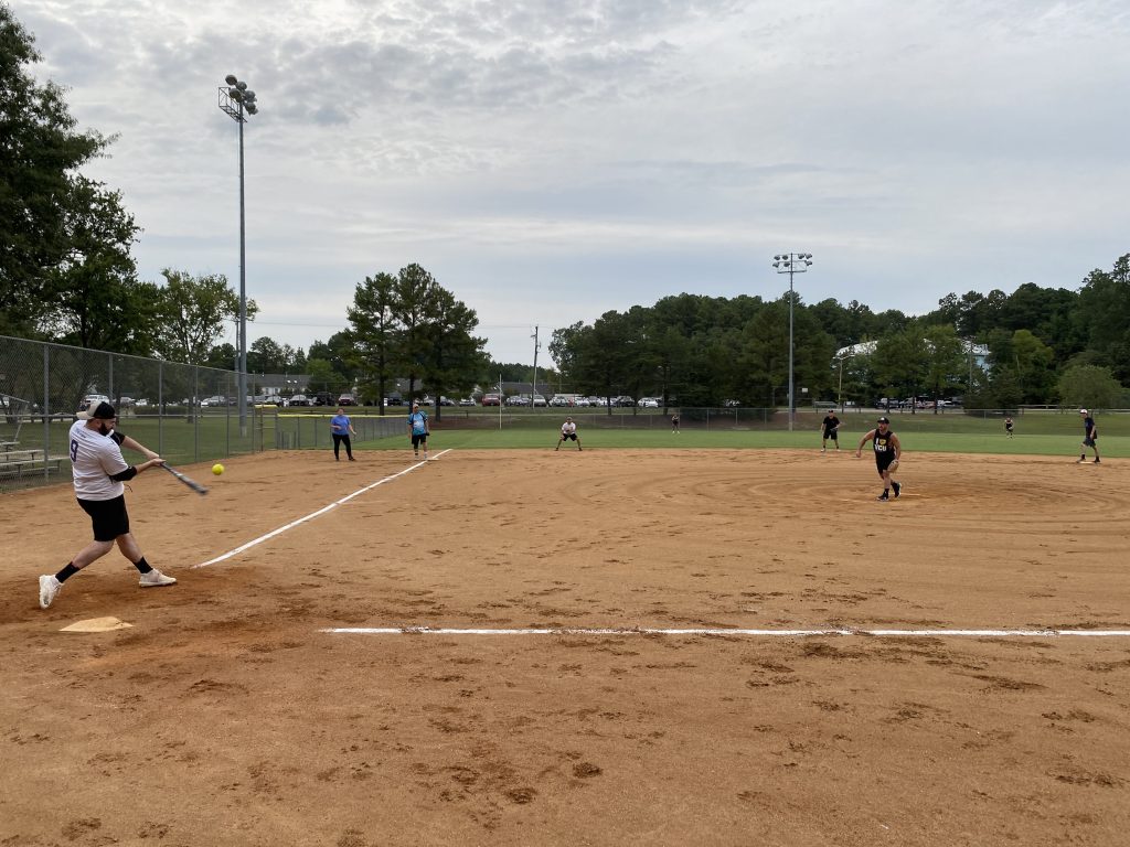 A group of RVA Softball Team members playing a game.