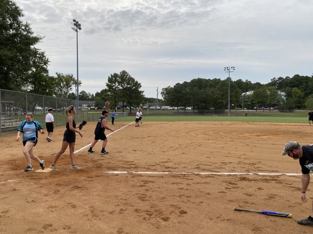 A group of people playing a game of RVA Softball.