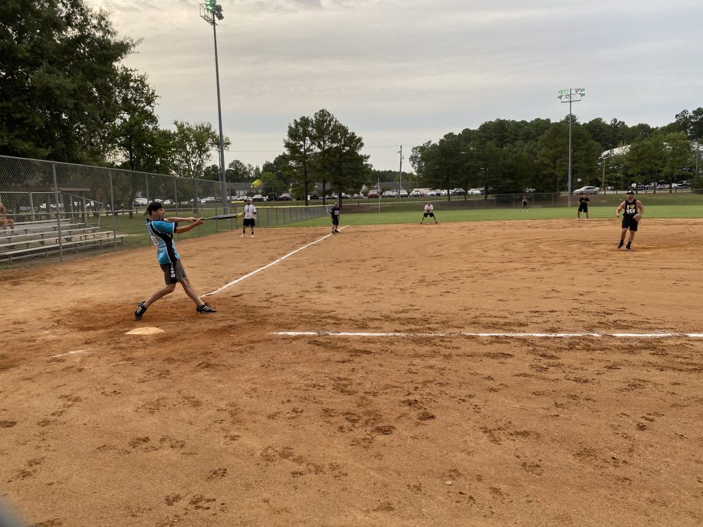 Erich clubs the softball.