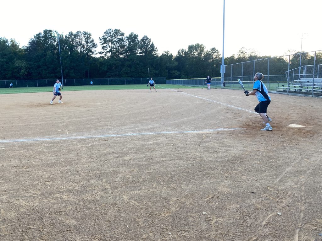 A group of people playing a game of softball in Richmond, Virginia.