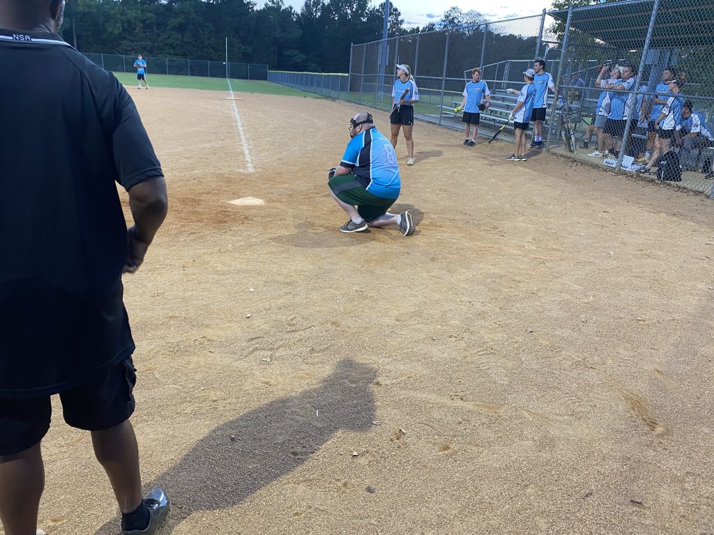Brent taking a knee behind the plate while catching for Colleen!