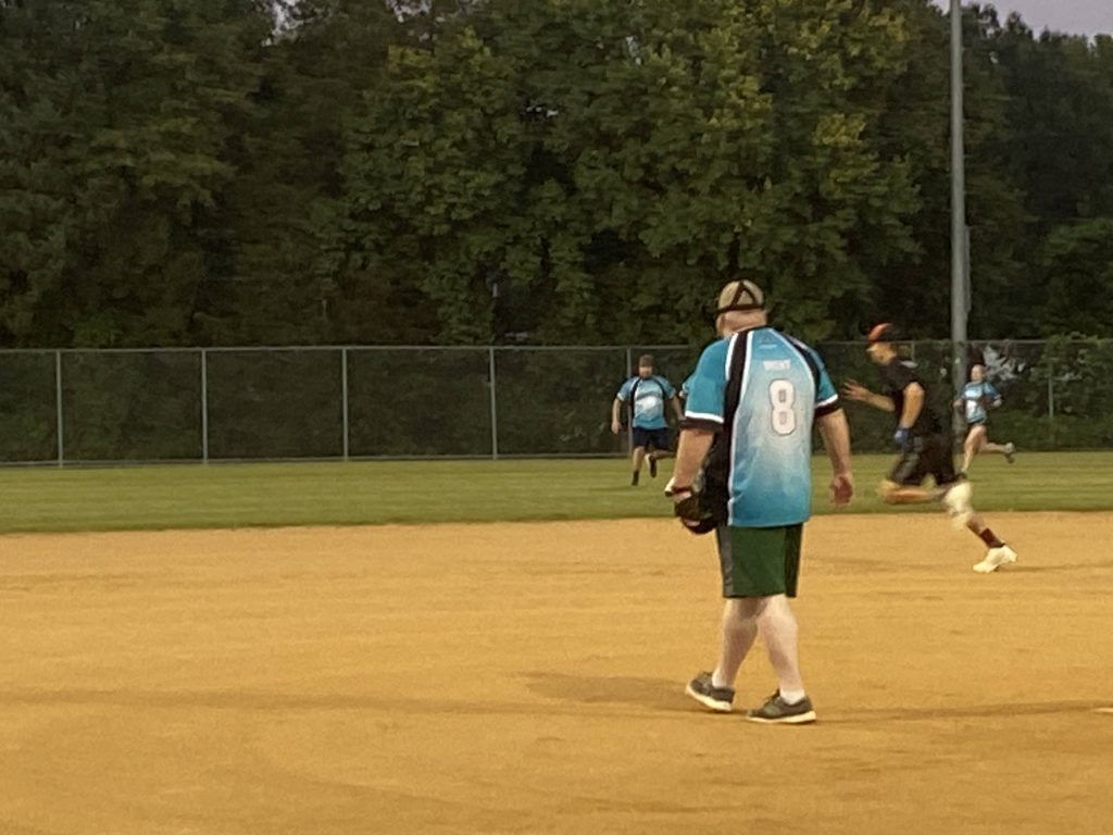 A group of people playing a game of softball. (Keywords: RVA Softball Team Photos)